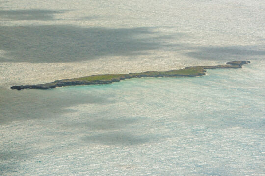 Aerial view of a long and skinny rocky island