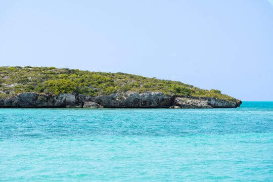 Turquoise water and sea cliffs at Pusey Cay