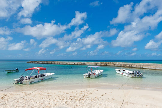 Dive boats anchored off the beach in Salt Cay