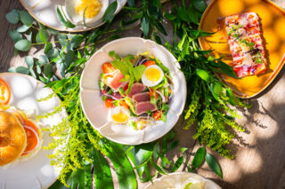 Salad with egg, tuna, lettuce, and tomato.