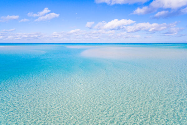 The shallow water and beach near Sandy Point Marina on North Caicos