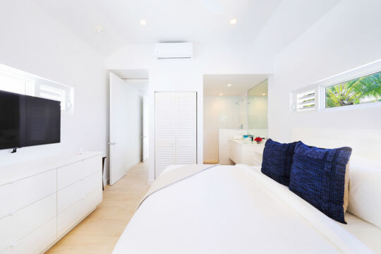 Modern bright bedroom with an ensuite bathroom