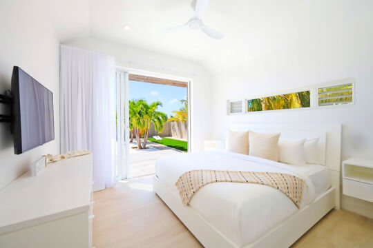 Bedroom with large sliding doors opening onto a patio