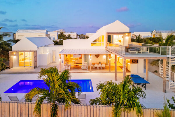Luxury villa lit up at night in Turks and Caicos. 