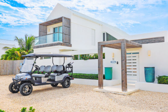 Beach cart parked outside a luxury villa in Turks and Caicos