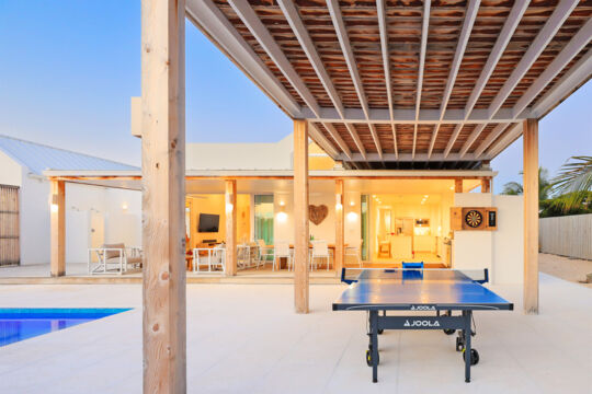 Ping-pong table on the pool deck of a luxury villa