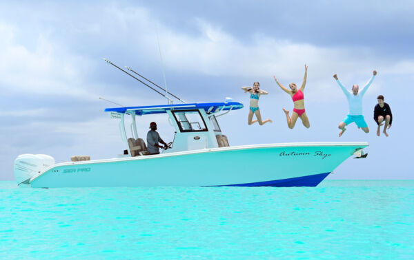 Family jumping off a boat charter into turquoise water