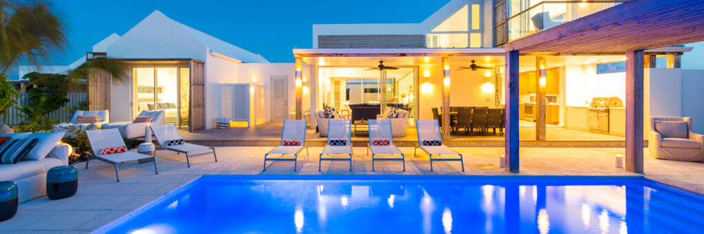 Exterior of Second Chances villa and pool at dusk