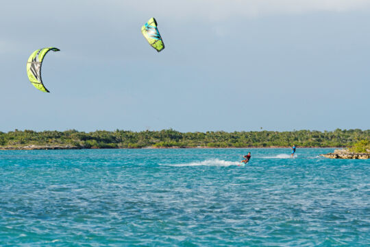 People kiteboarding at the Sinking Cays in Turks and Caicos