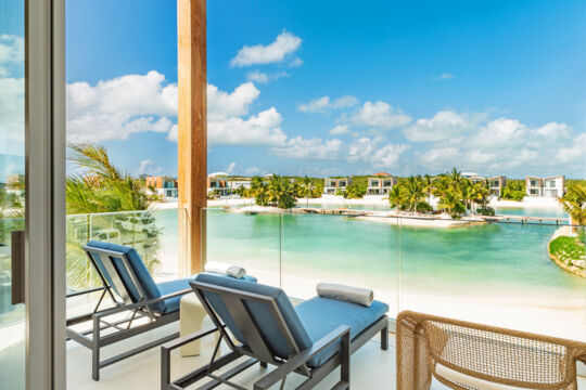 Patio overlooking a turquoise lagoon in Turks and Caicos.