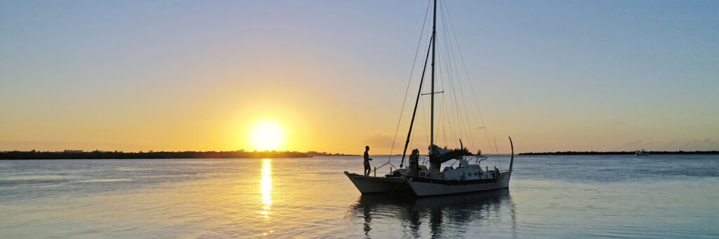 Sailboat at sunset off Grace Bay