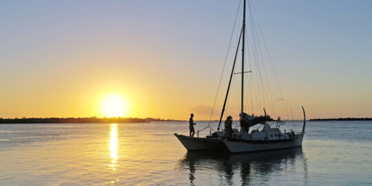 Sailboat at sunset off Grace Bay