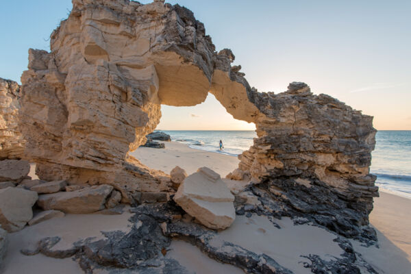 natural rock arch on the beach at Water Cay in the Turks and Caicos