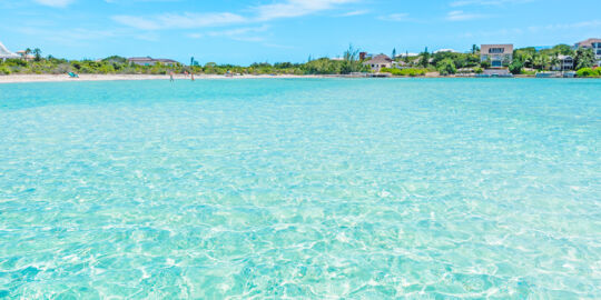 The view from the water of Taylor Bay and vacation rental villas