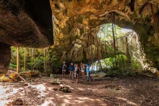 Tour group exploring an open cave in Turks and Caicos. 