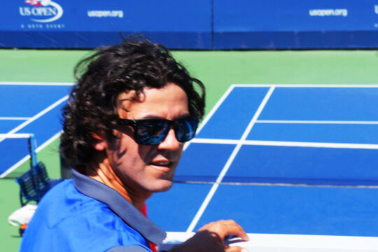Closeup of tennis instructor Rey Garcia on a tennis court