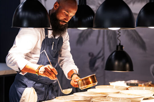 Chef plating a cod dish in Turks and Caicos. 