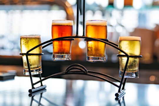 Flight of four beers at a bar