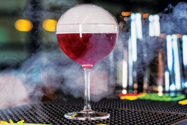 Purple cocktail with an edible bubble. 