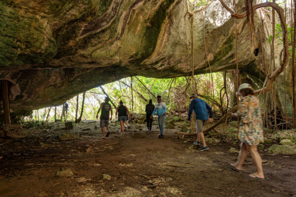 Tourists exploring a cave in Turks and Caicos.