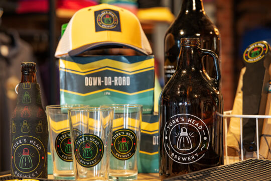 Beer koozies and glasses for sale at the Turk's Head Brewery.