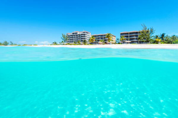 Over under view of the beach and water at The Tuscany resort on Grace Bay Beach