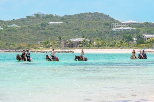 Horseback riding in the water off Blue Hills Beach in the Turks and Caicos