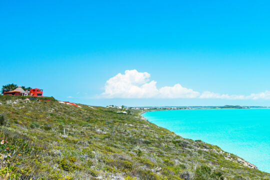 Sloping coastal cliff and brilliant turquoise water in the Venetian Road area
