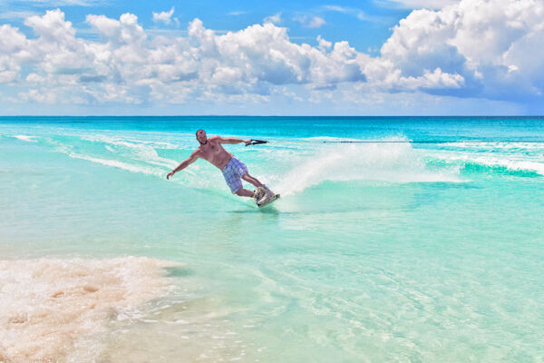 Wakeboarding off a beautiful beach in the Turks and Caicos