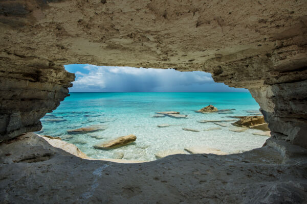 Rock cave and arch on the coastline of Water Cay