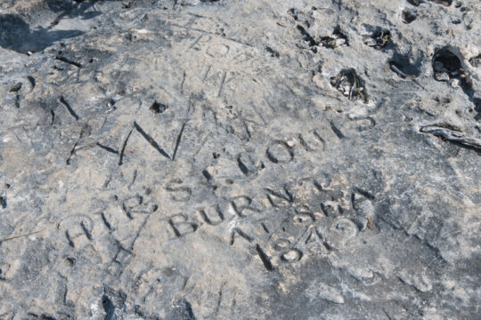 Historical rock carving at West Harbour Bluff on Providenciales