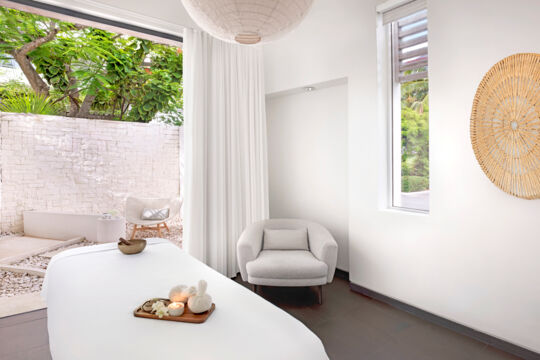 Massage table with rock garden at spa.