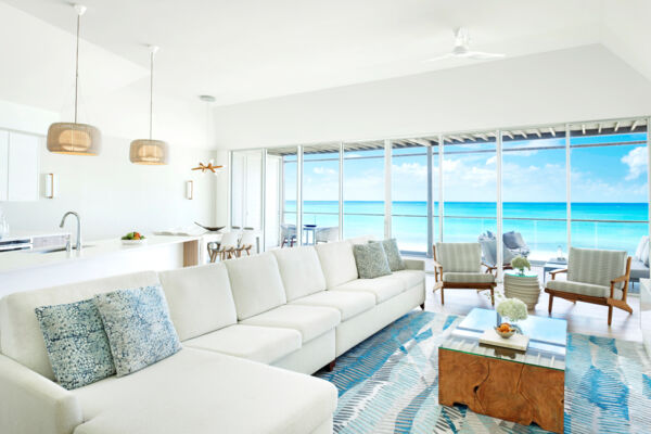 Ocean view from penthouse suite at modern resort.